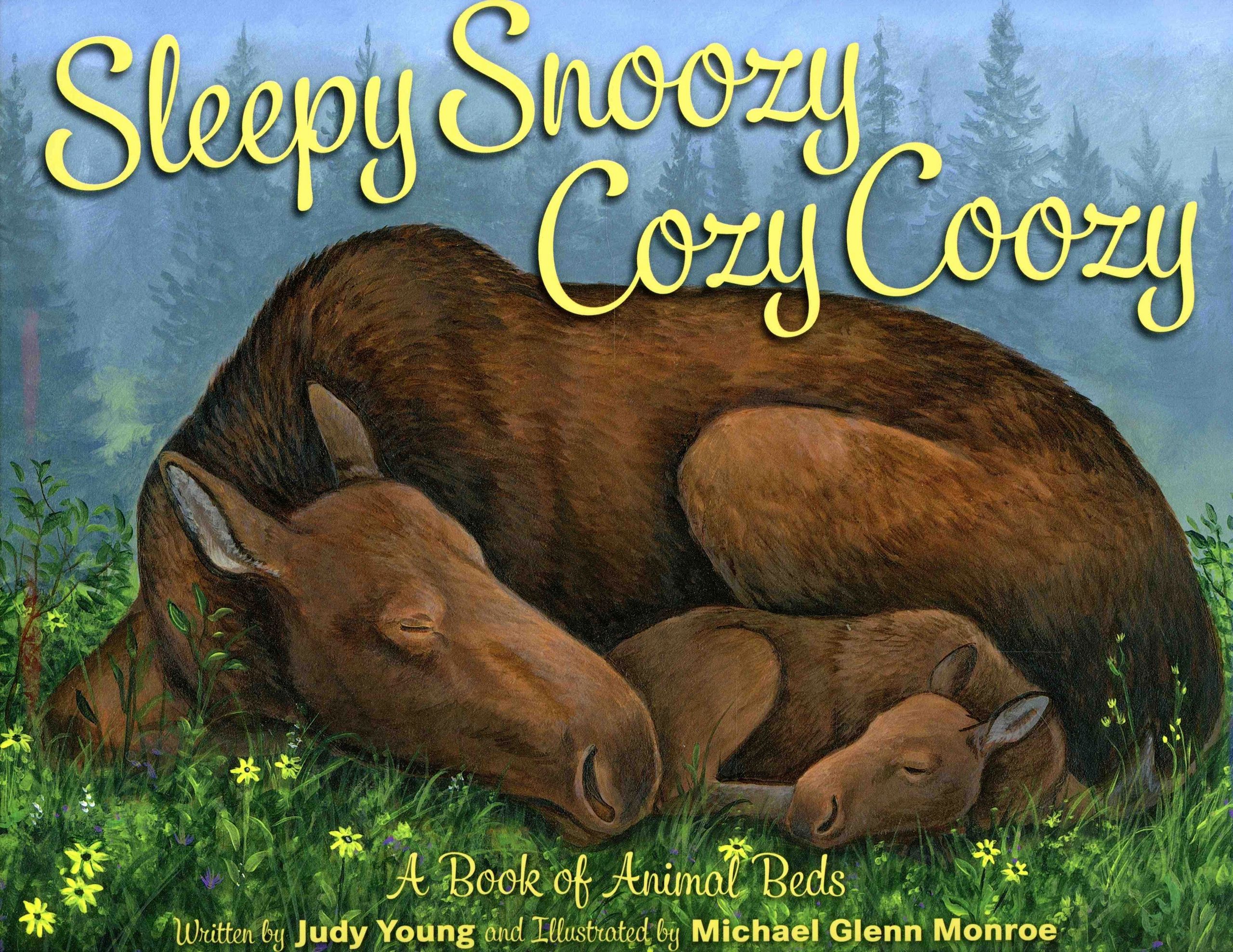 Moose and calf sleeping in the forest.