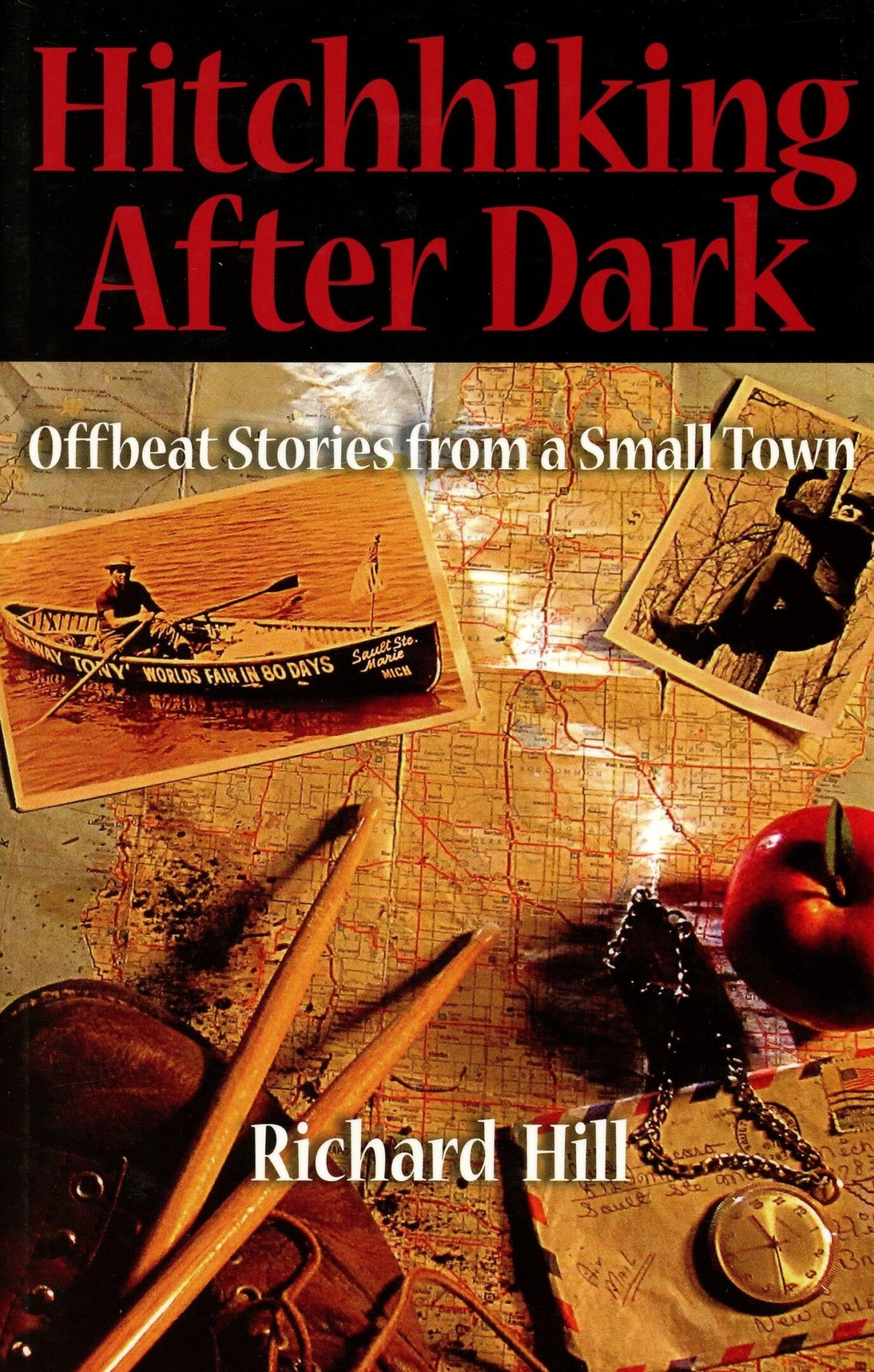 Book cover with map, postcards, and apple.
