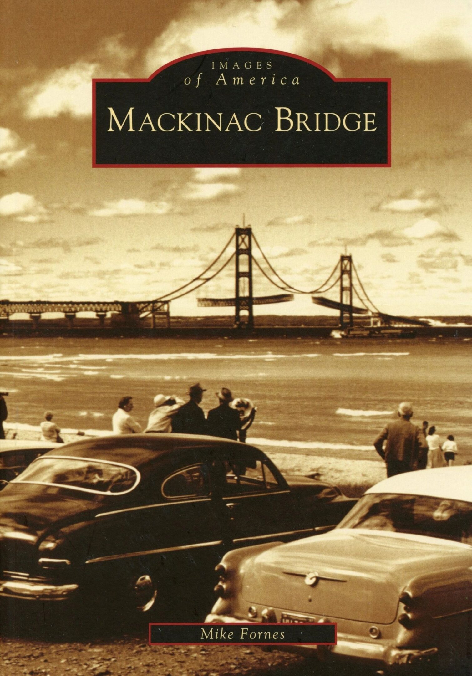 Vintage cars near Mackinac Bridge, sepia-toned.