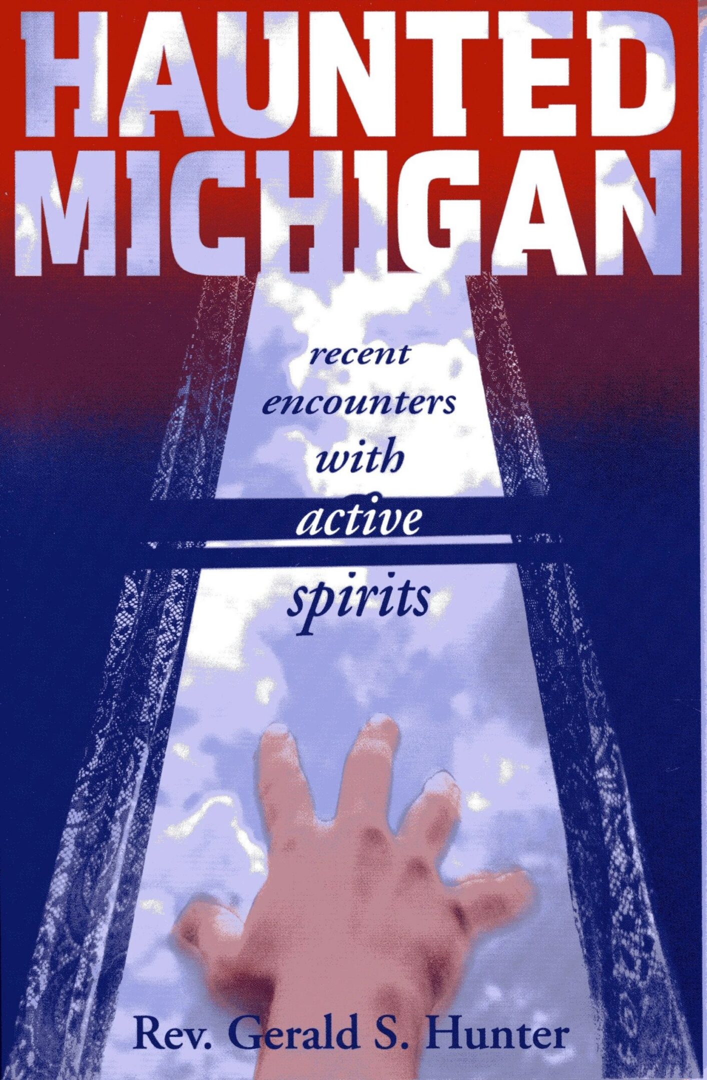 Haunted Michigan book cover with reaching hand.