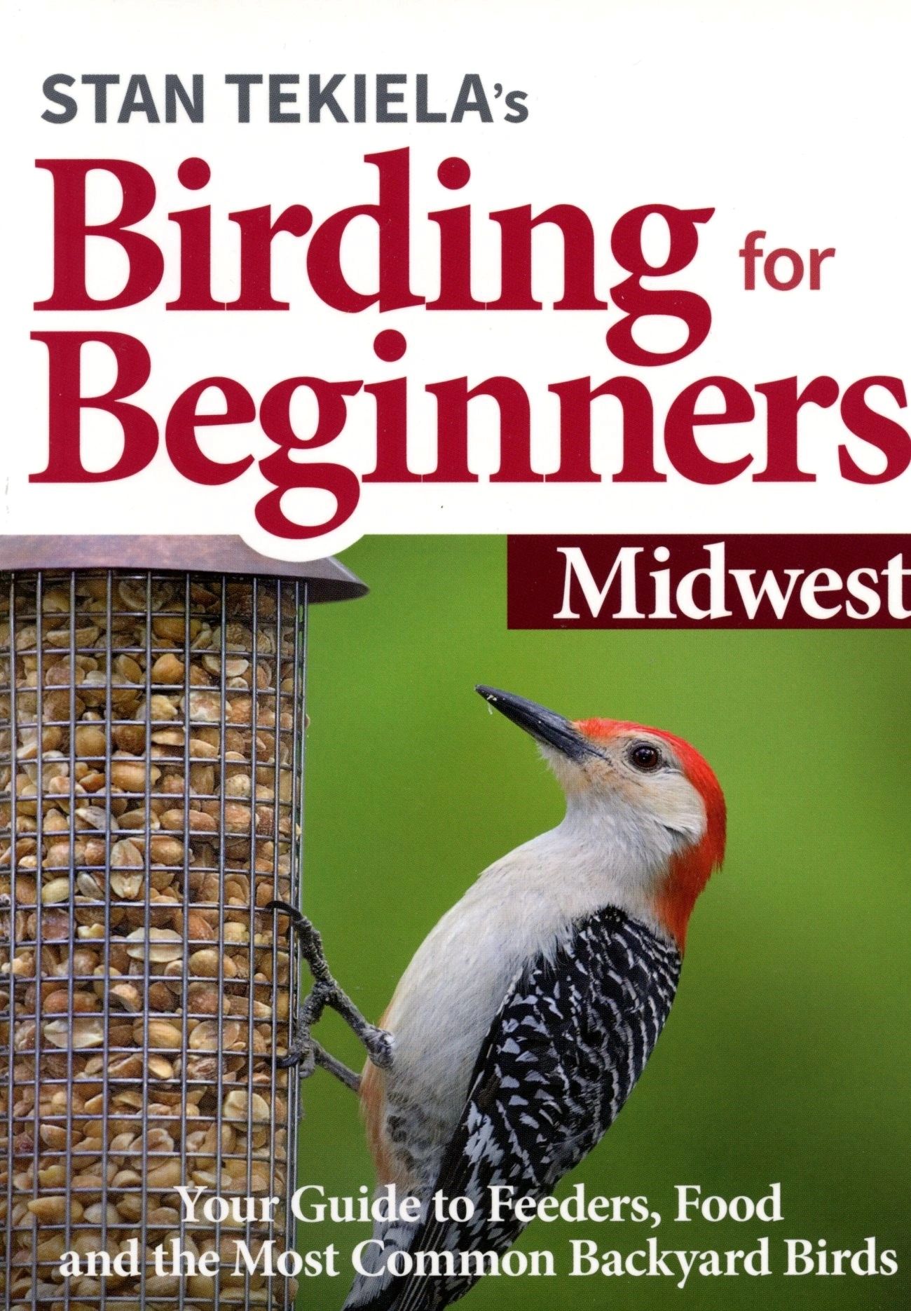 Birding book cover with woodpecker and feeder.