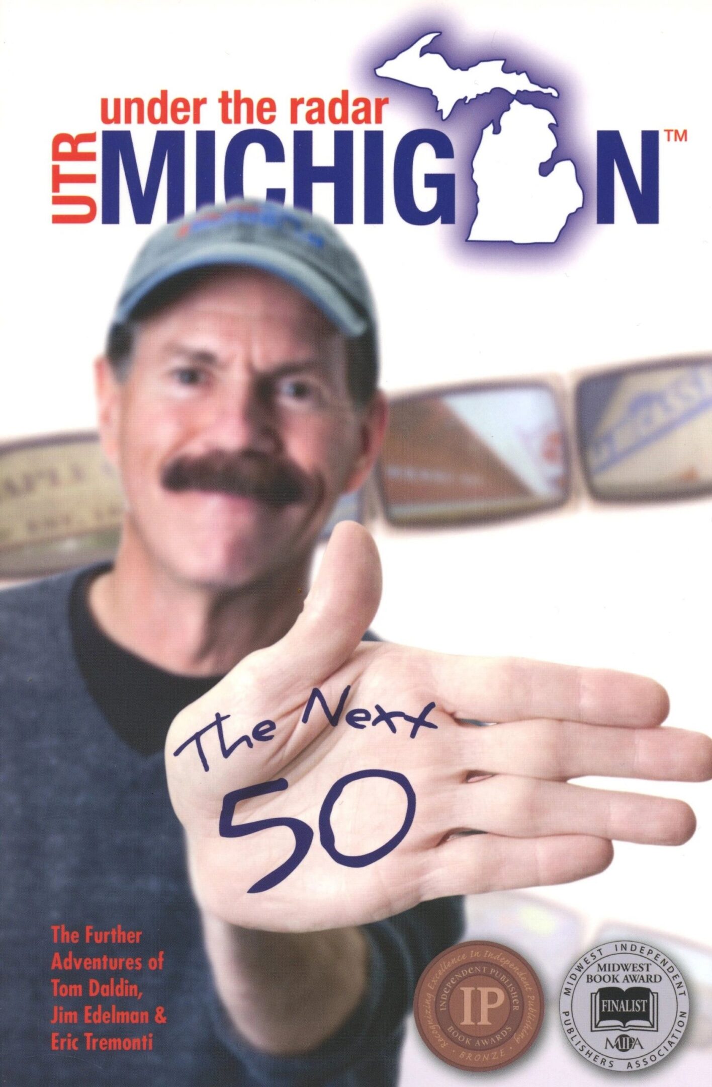 Man holding out hand with "The Next 50.