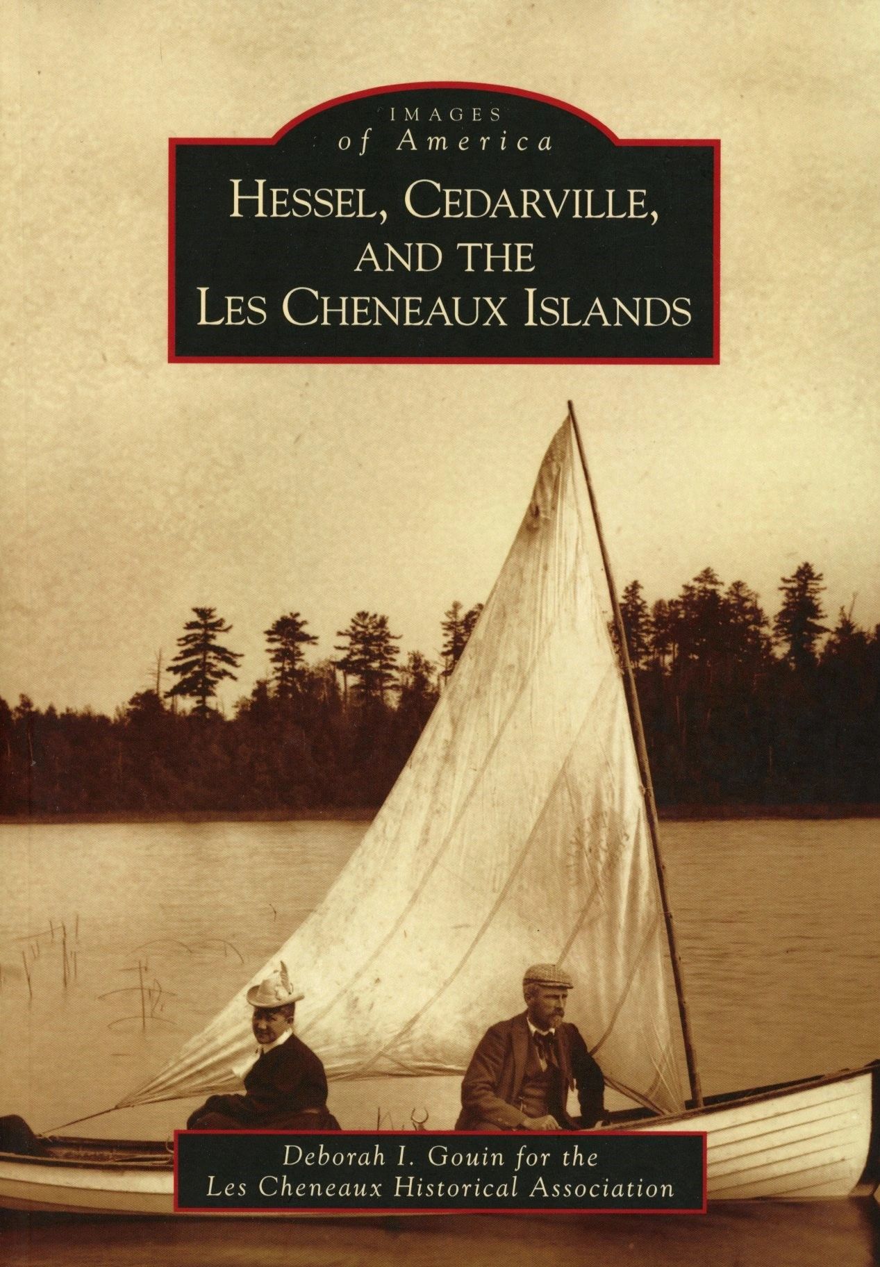 Men in boat with large sail.