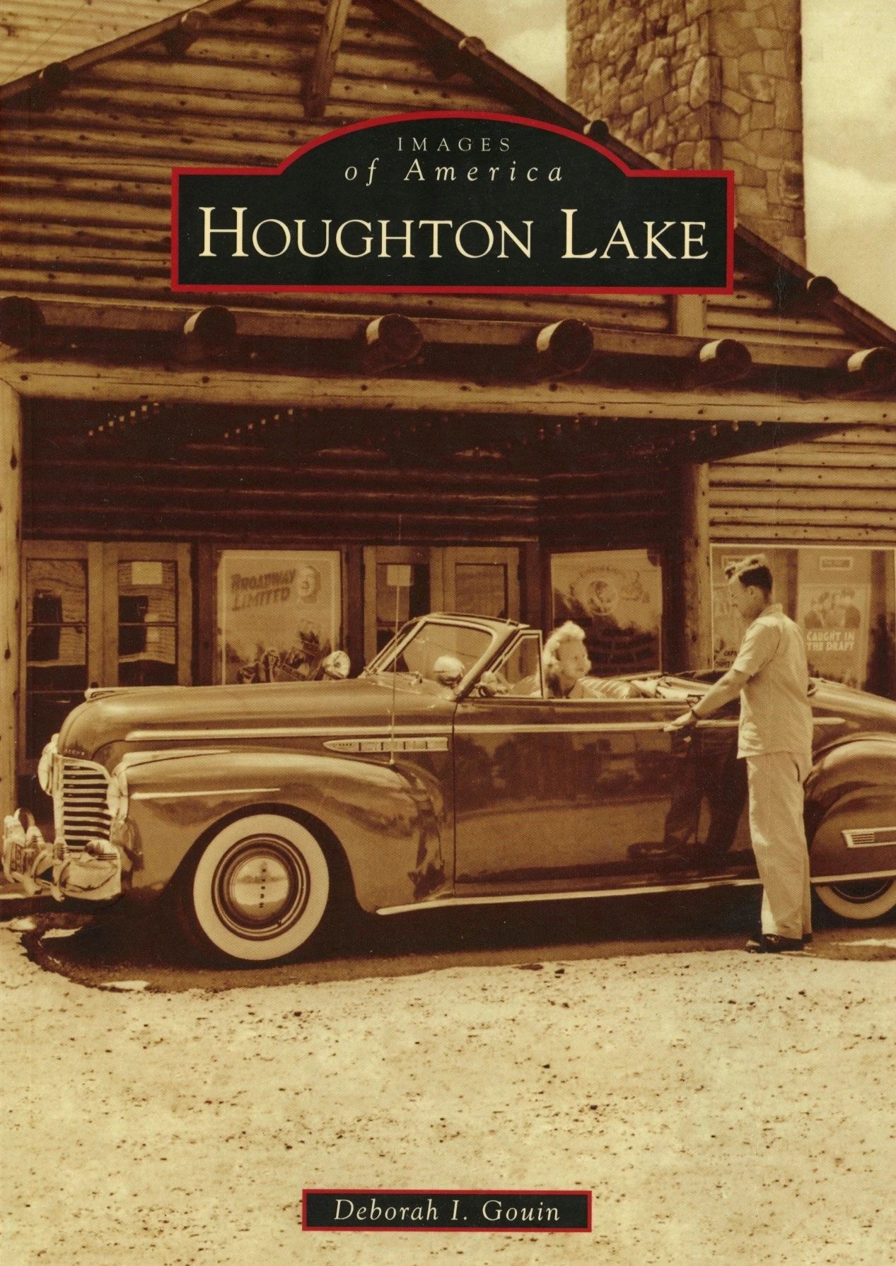 Vintage car in front of rustic building.