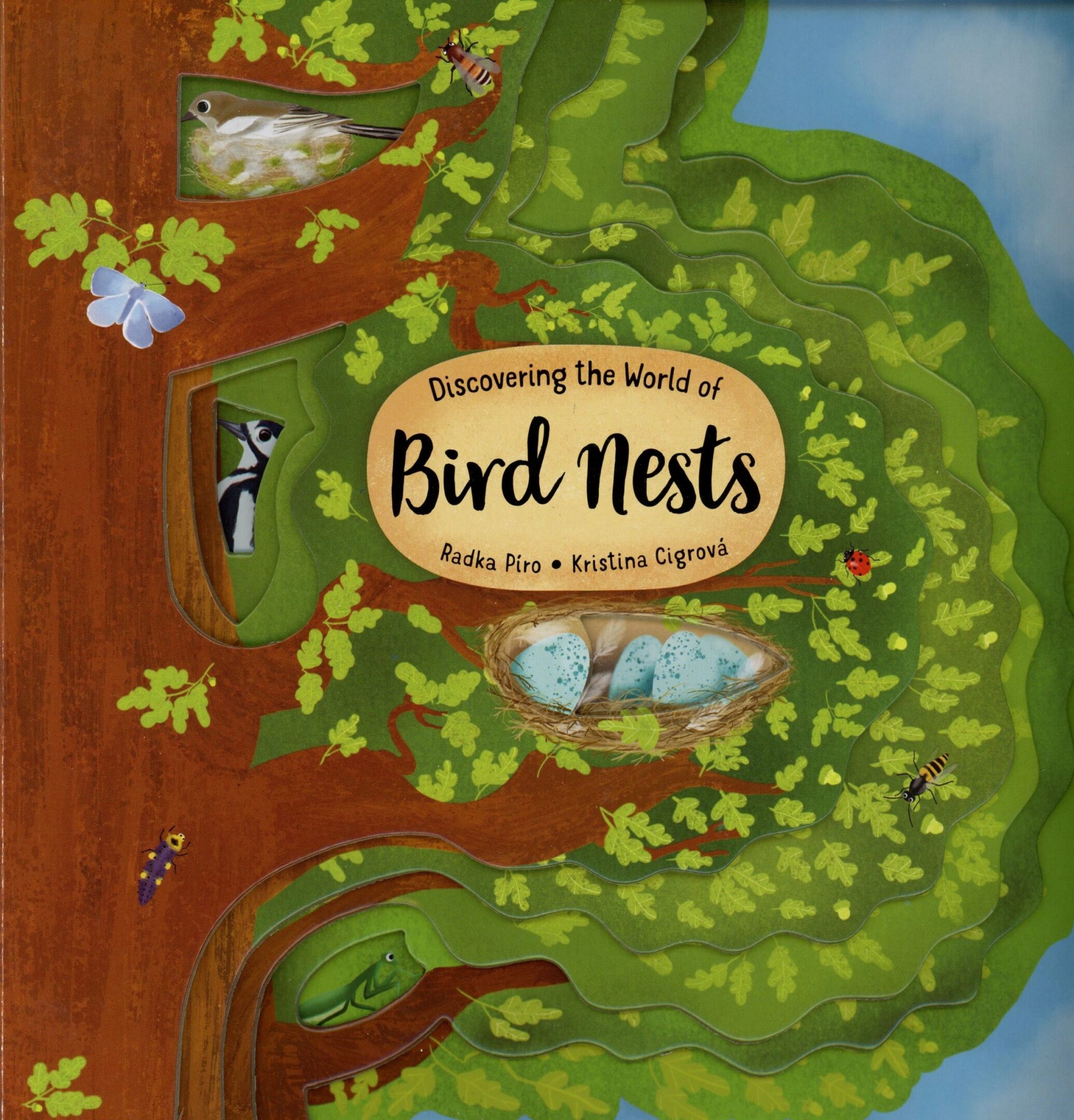 Children's book cover with tree and birds.